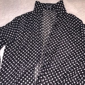 Polka Dot Flare blouse. arms flare out